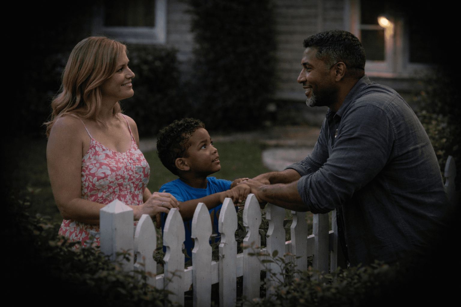 I’d been watching the Hawthorne place for three evenings before this moment lined itself up.
Becky stood easy on her side of the fence, relaxed in a way married women usually aren’t when company drops by unannounced. The neighbor leaned in from the other side, elbows resting on the pickets like he belonged there. Like he’d done this before. Plenty of times.
Then there was the kid.
Brent looked up at the neighbor with the kind of familiarity you don’t teach. Same eyes. Same tilt of the head. Same crooked half-smile that shows up when a man thinks he’s being charming instead of careful. I’d seen Elias Hawthorne’s photo—good man, square jaw, straight lines. None of that showed up in the boy.
Becky noticed me watching. Just for a second. Her smile tightened, then loosened again, practiced and smooth. The neighbor laughed at something she said, hand drifting a little too close to the fence post between them. Territorial, maybe. Or nostalgic.
Nobody crossed the line. Not physically. But lines don’t always need crossing to leave footprints.
The fence stayed standing. The conversation stayed polite. The kid stayed between them like an unanswered question.